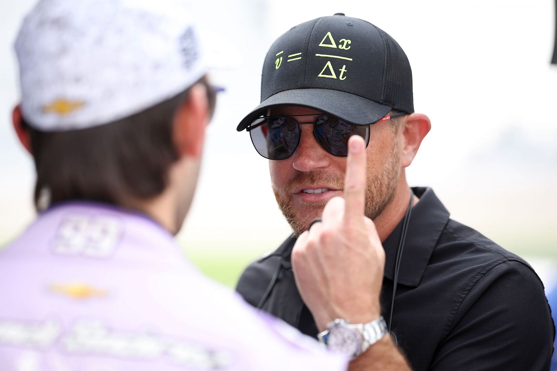 Trackhouse Racing team owner Justin Marks speaks to Daniel Suárez at Nashville Superspeedway. Source: Getty